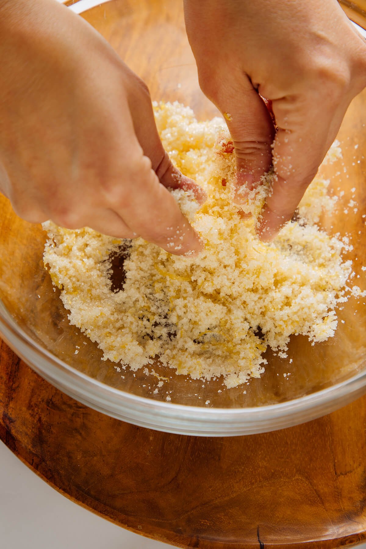 rubbing lemon zest into sugar