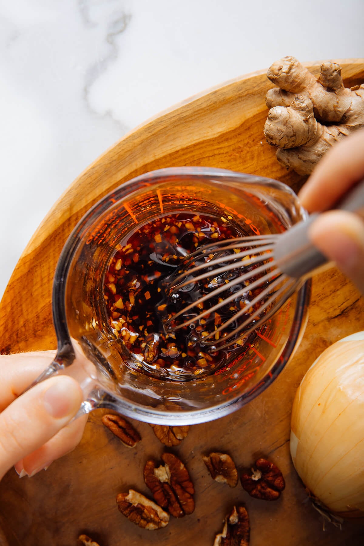 whisking sauce together