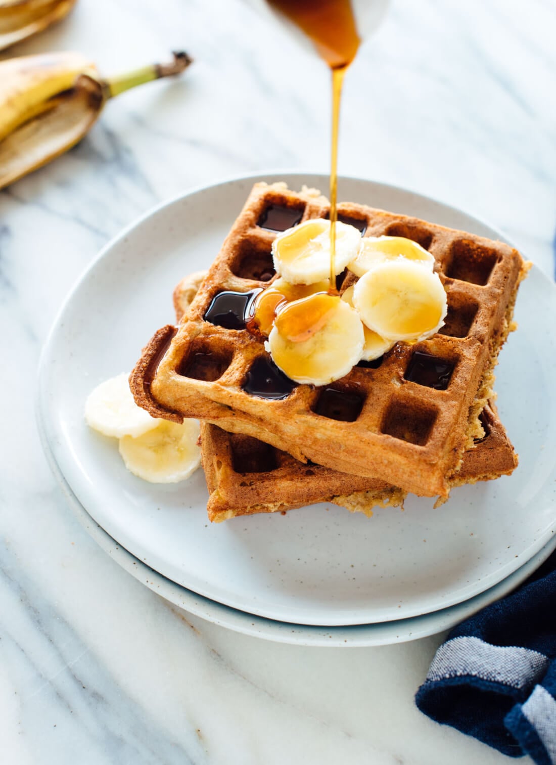 Incredible gluten-free banana oat waffles! These gluten-free waffles require only one kind of flourโoat flourโwhich is easy to make yourself with old-fashioned oats! cookieandkate.com
