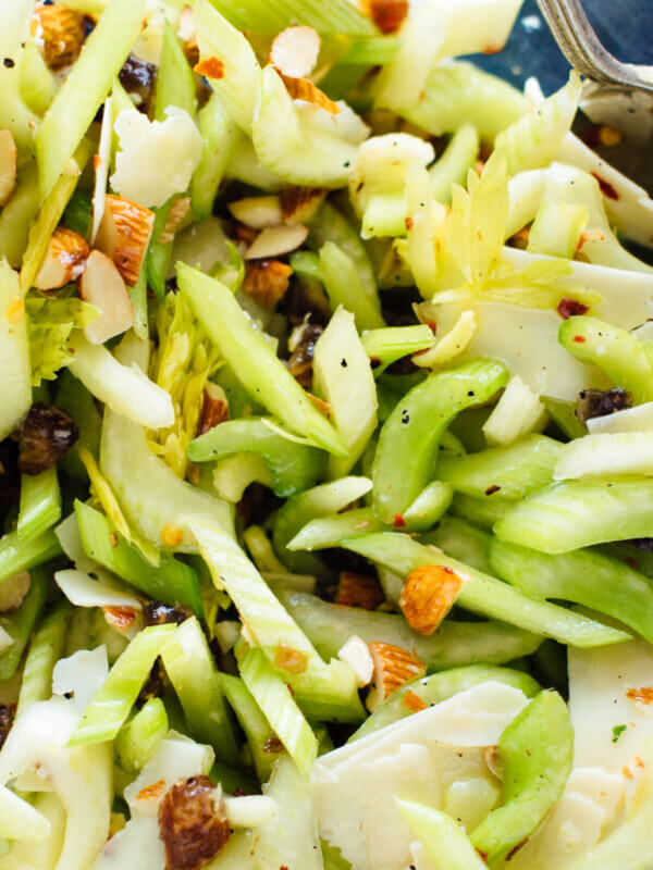 This celery salad recipe will surprise you! Crisp celery, toasted almonds, sweet dates and Parmesan combine to create a delicious, crisp, fresh salad. cookieandkate.com