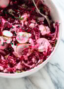 This hot pink slaw is totally irresistible, thanks to—surprise—coconut! If you like coconut, you're going to love this nutrient-dense slaw/side salad. cookieandkate.com