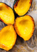 roasted acorn squash on pan