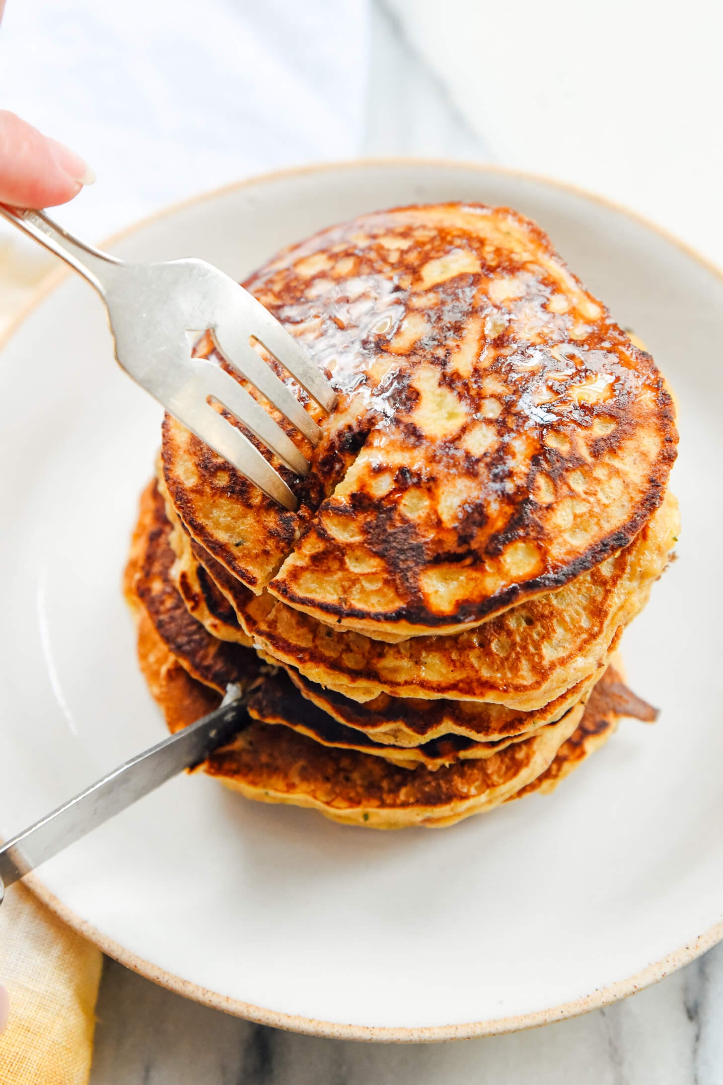 slicing into banana pancakes