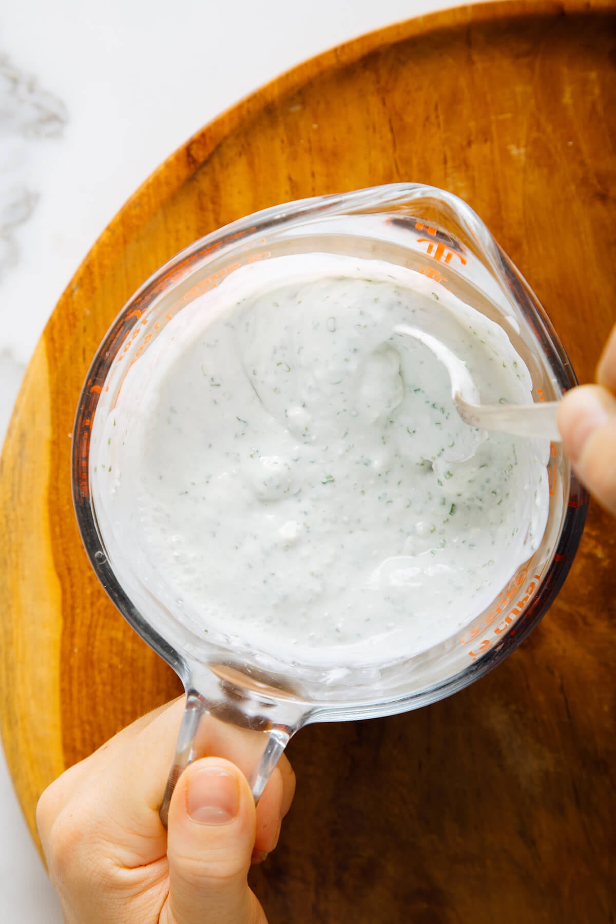 stirring blue cheese dressing